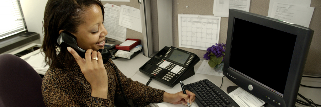 African American woman on the phone in an office setting
